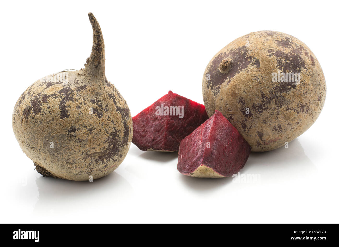 Two beetroot bulbs (raw red beet) and two pieces isolated on white background Stock Photo