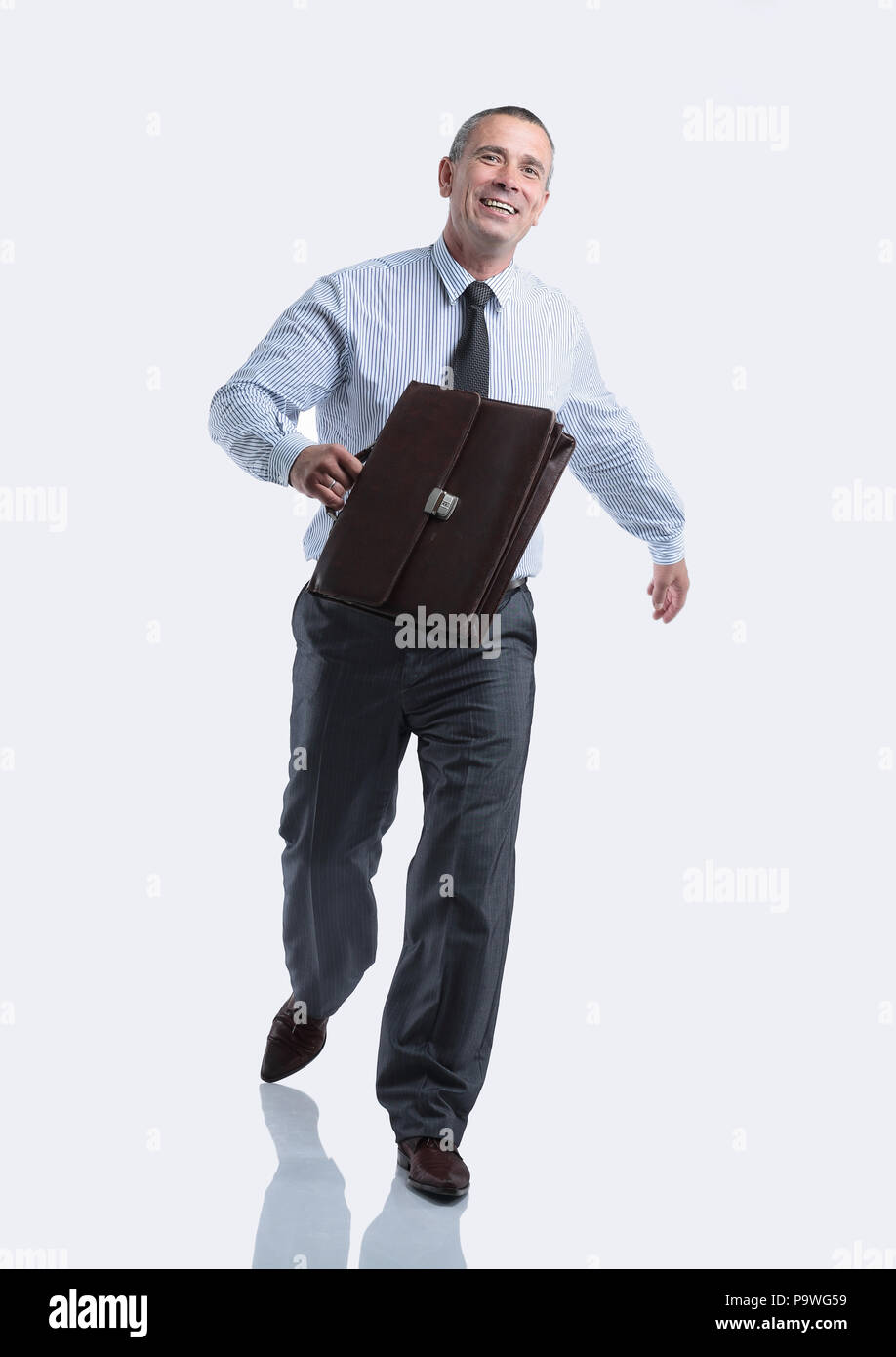 modern business man with a briefcase going forward Stock Photo