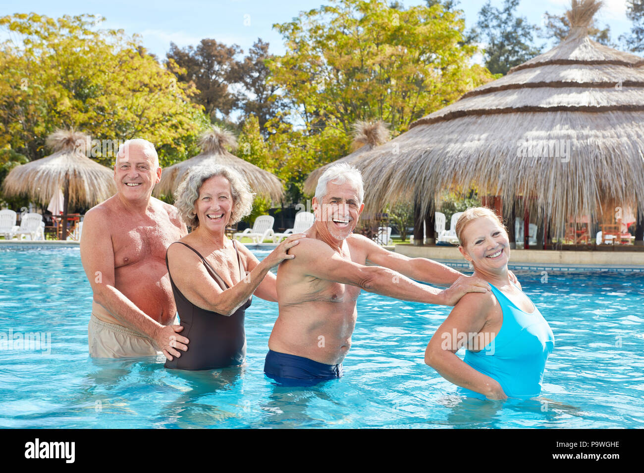 Senior Pool Fun Senior group has fun with aqua fitness in the swimming pool of the ...