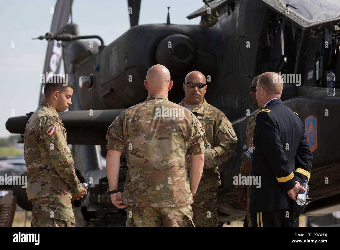 US Army personnel of an Apache helicopter at the Farnborough Airshow, on 16th July 2018, in Farnborough, England. Stock Photo