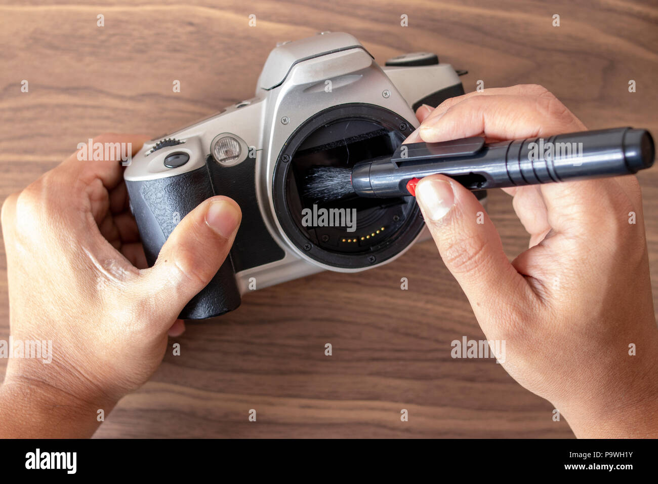 Performing a maintenance on a camera with tools Stock Photo Alamy