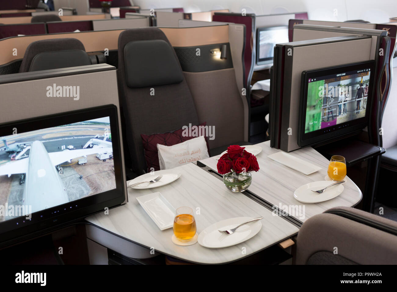 Business Class meals and luxury seating in a Qatar Airways Airbus A350-1000 at the Farnborough Airshow, on 18th July 2018, in Farnborough, England. Stock Photo