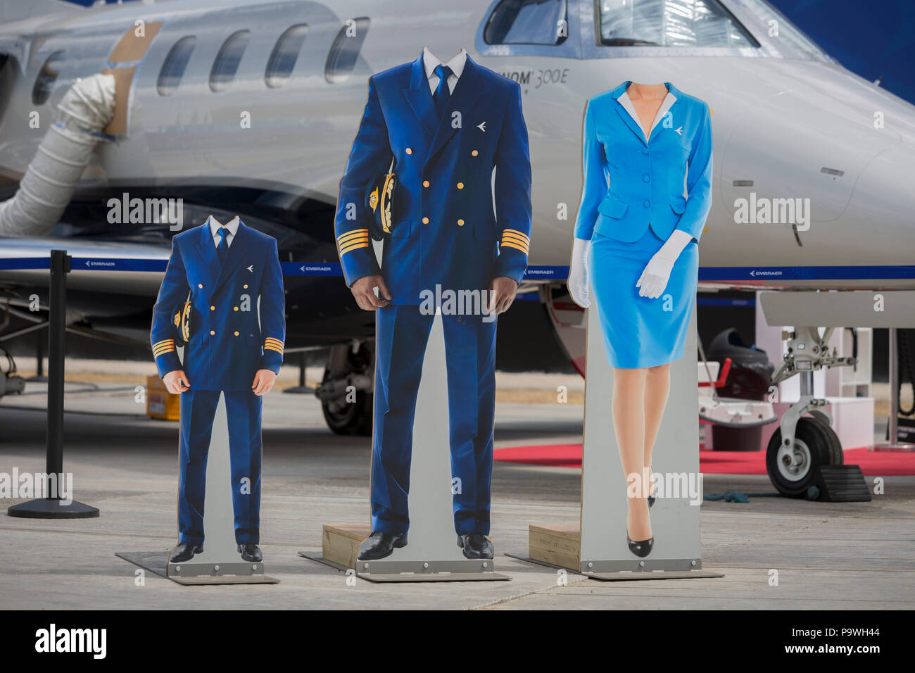 Headless cut-outs for visisors at the Embraer exhibit at the Farnborough Airshow, on 16th July 2018, in Farnborough, England. Stock Photo