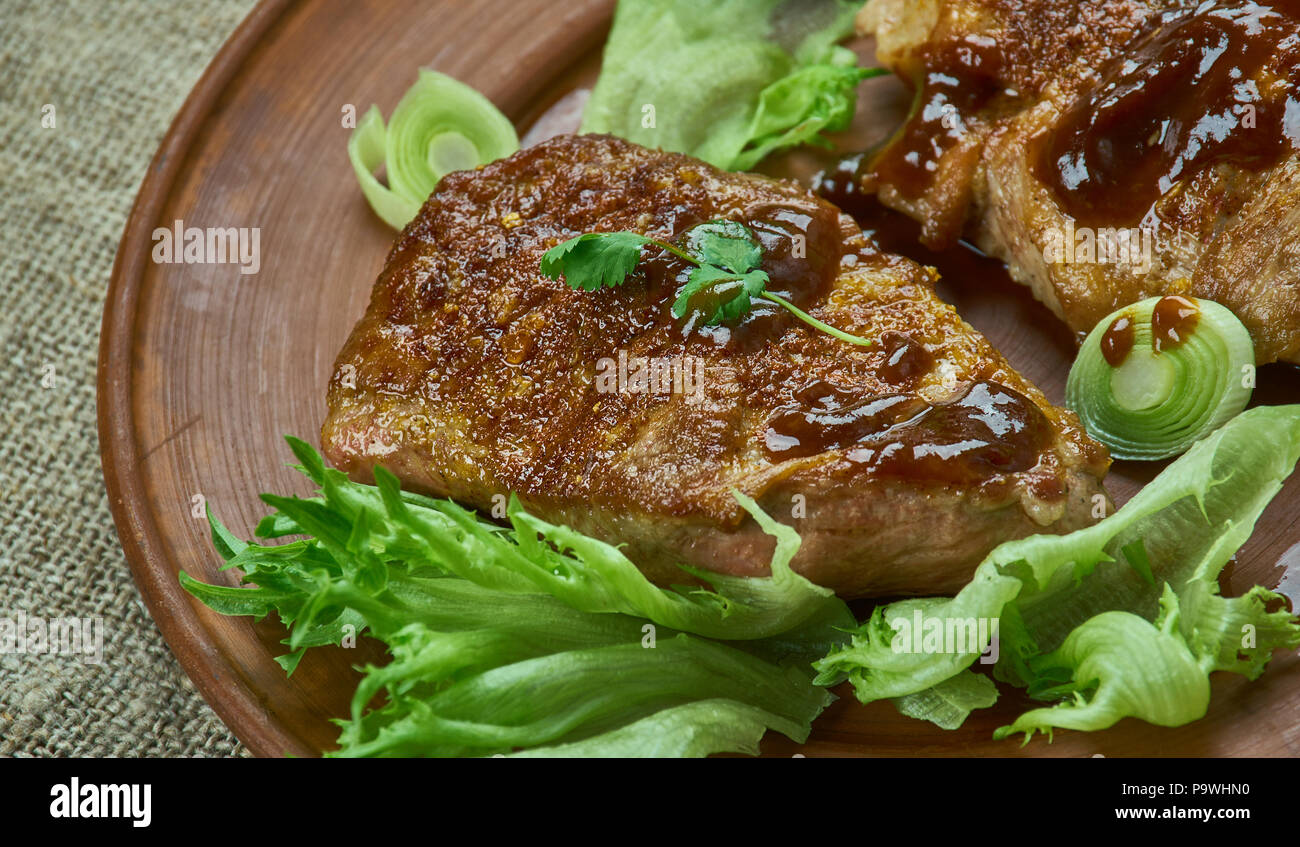 Brown Sugar Pork Chops with Peach Barbecue Sauce Stock Photo Alamy