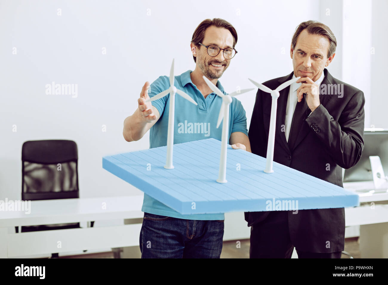 Unusual project. Happy excited talented engineer introducing a ...