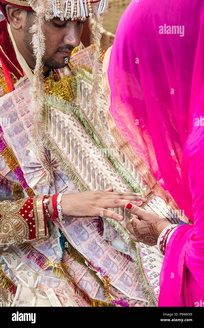 A traditional wedding in the Indian province.The groom accepts gifts,wishes and blessings from his family. India June 2018 Stock Photo