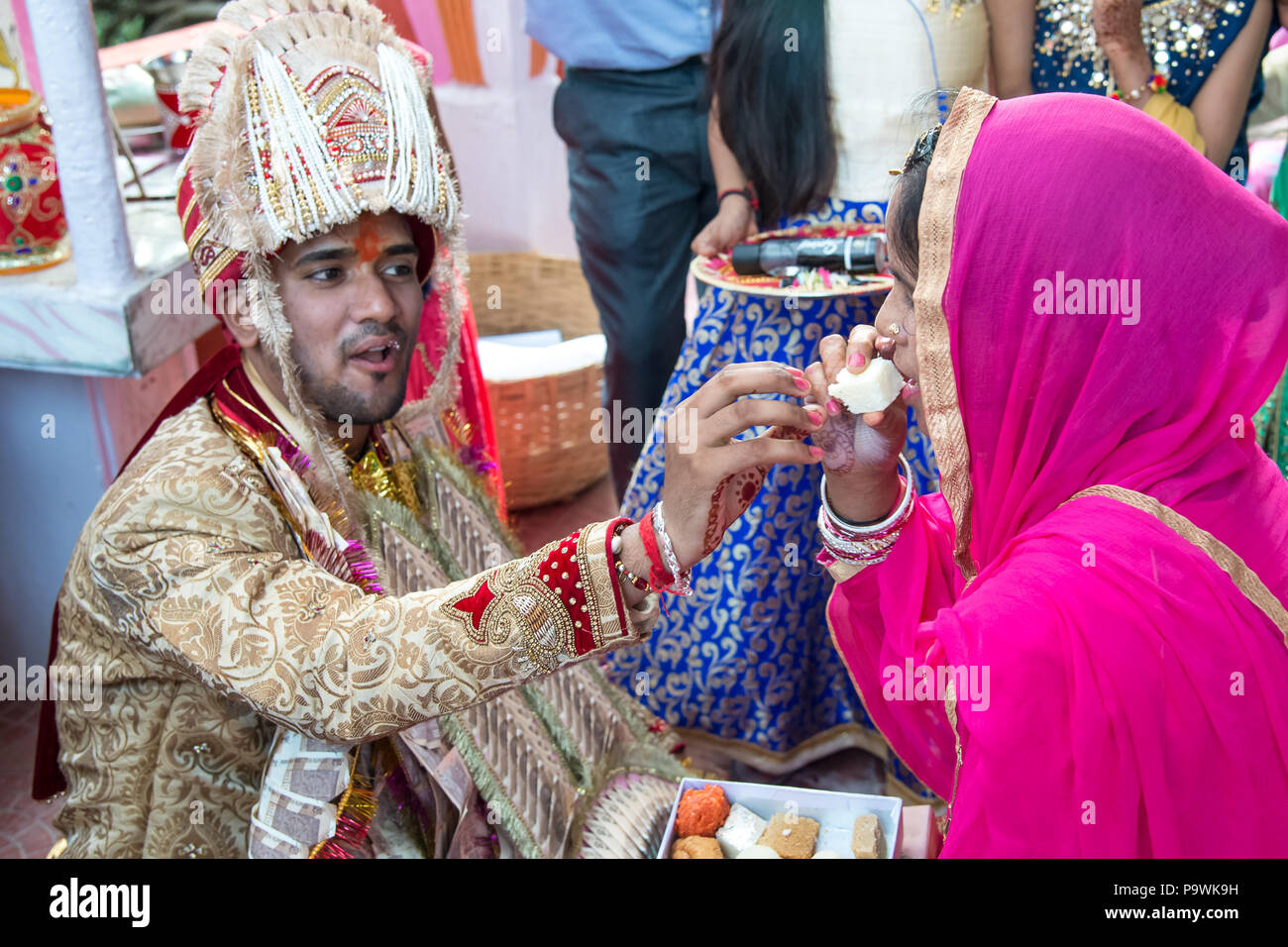 A traditional wedding in the Indian province.The groom accepts gifts,wishes and blessings from his family. India June 2018 Stock Photo