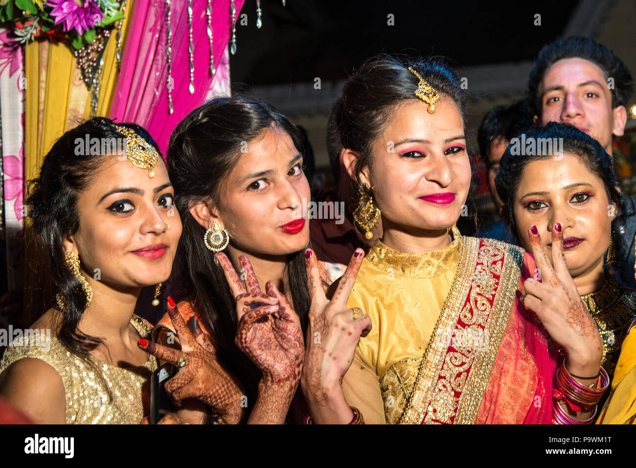 A traditional wedding in the Indian province. India  June 2018.Young girls in traditional, colorful costumes Stock Photo