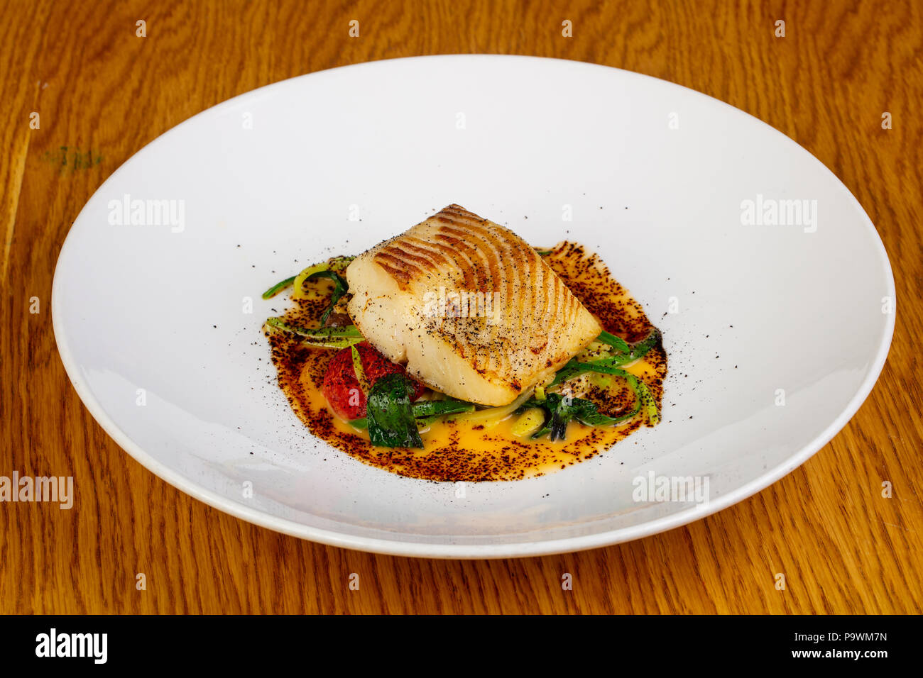 Roasted fish halibut with spices Stock Photo Alamy