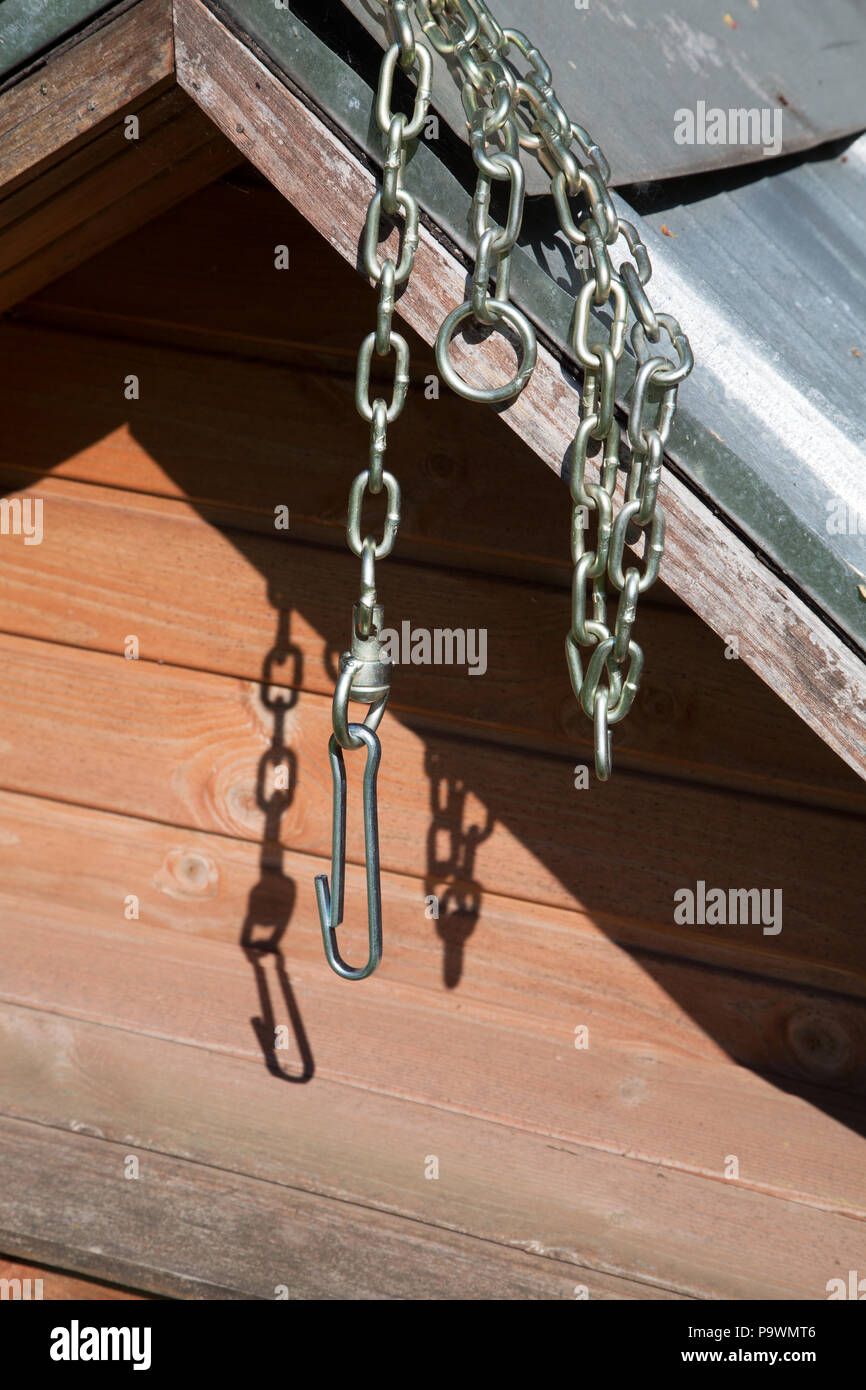 chain for a dog hanging on a booth on a sunny day Stock Photo