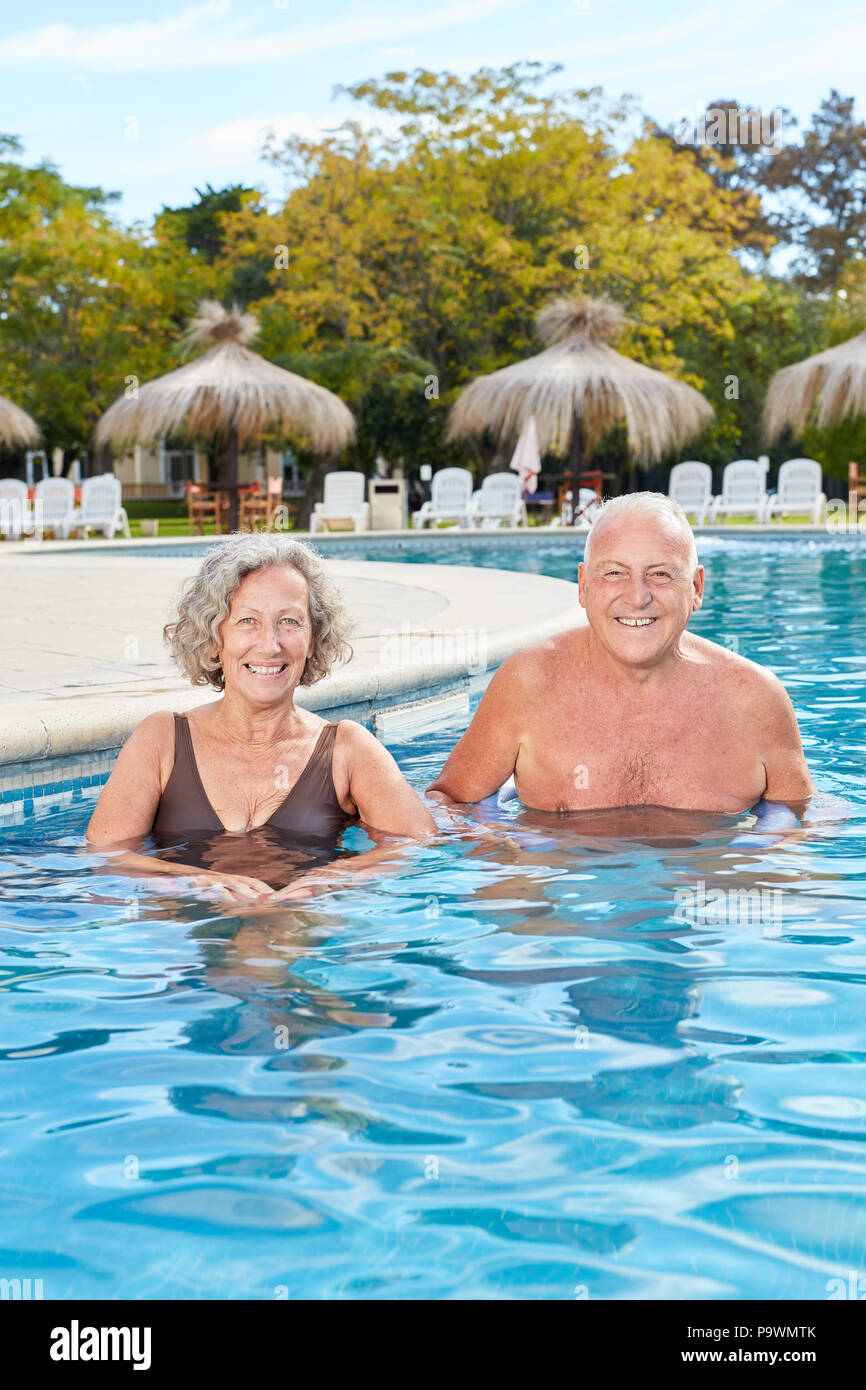 Happy senior couple swimming in the spa at the Wellness Hotel Stock Photo