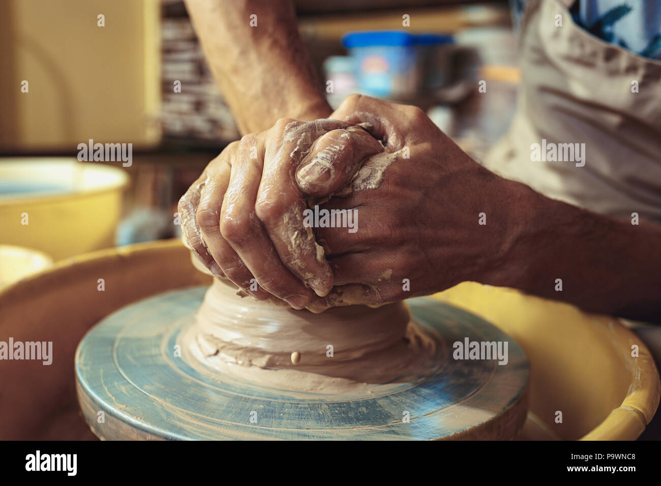 Creating a jar or vase of white clay closeup. Master crock Stock Photo