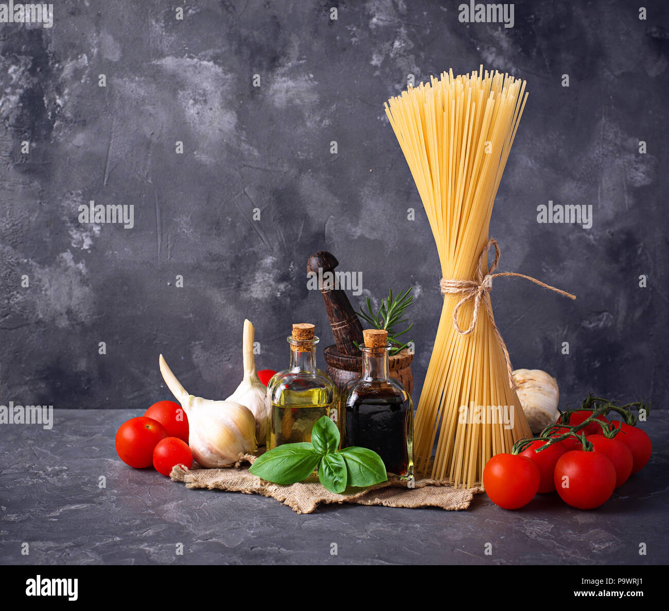 Pasta, tomatoes, olive oil and vinegar Stock Photo Alamy