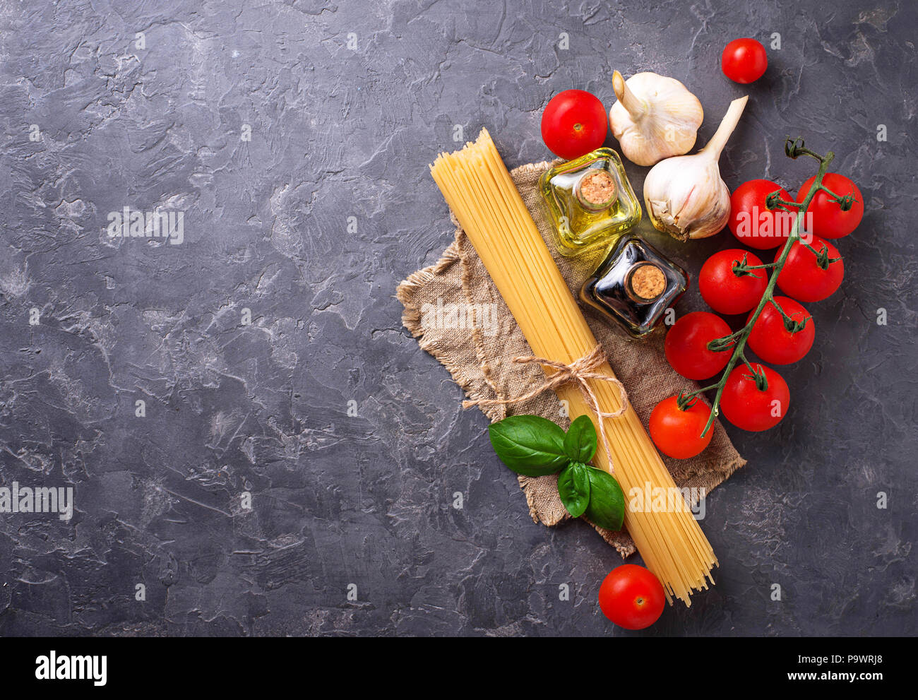 Pasta, tomatoes, olive oil and vinegar Stock Photo Alamy