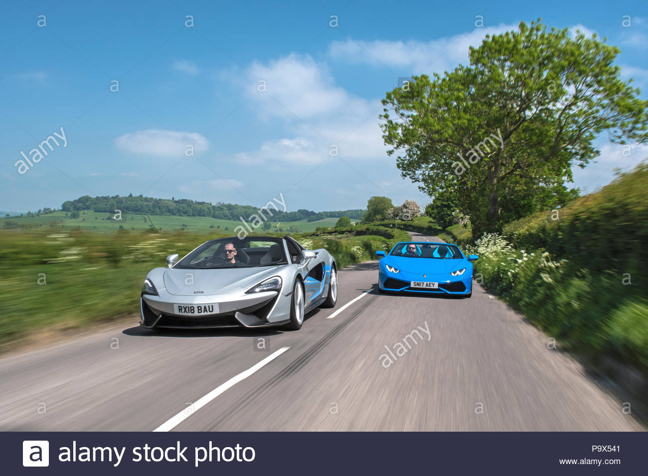 Mclaren 570s And Lamborghini Huracan Supercars Racing On Country