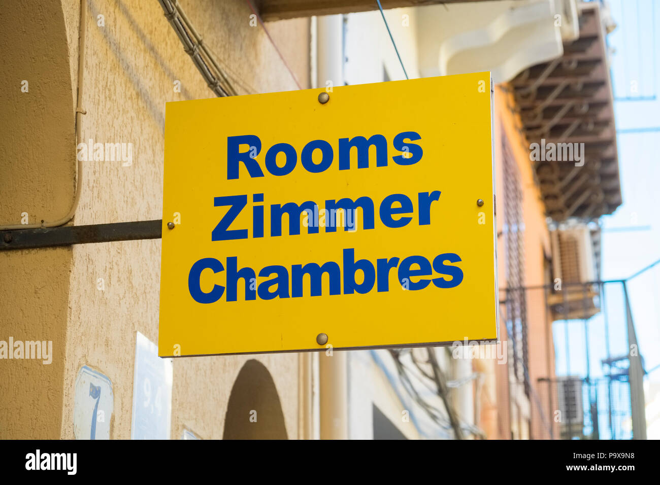 Rooms for hire sign translated into multiple languages English, German and French, Sicily, Italy, Europe Stock Photo