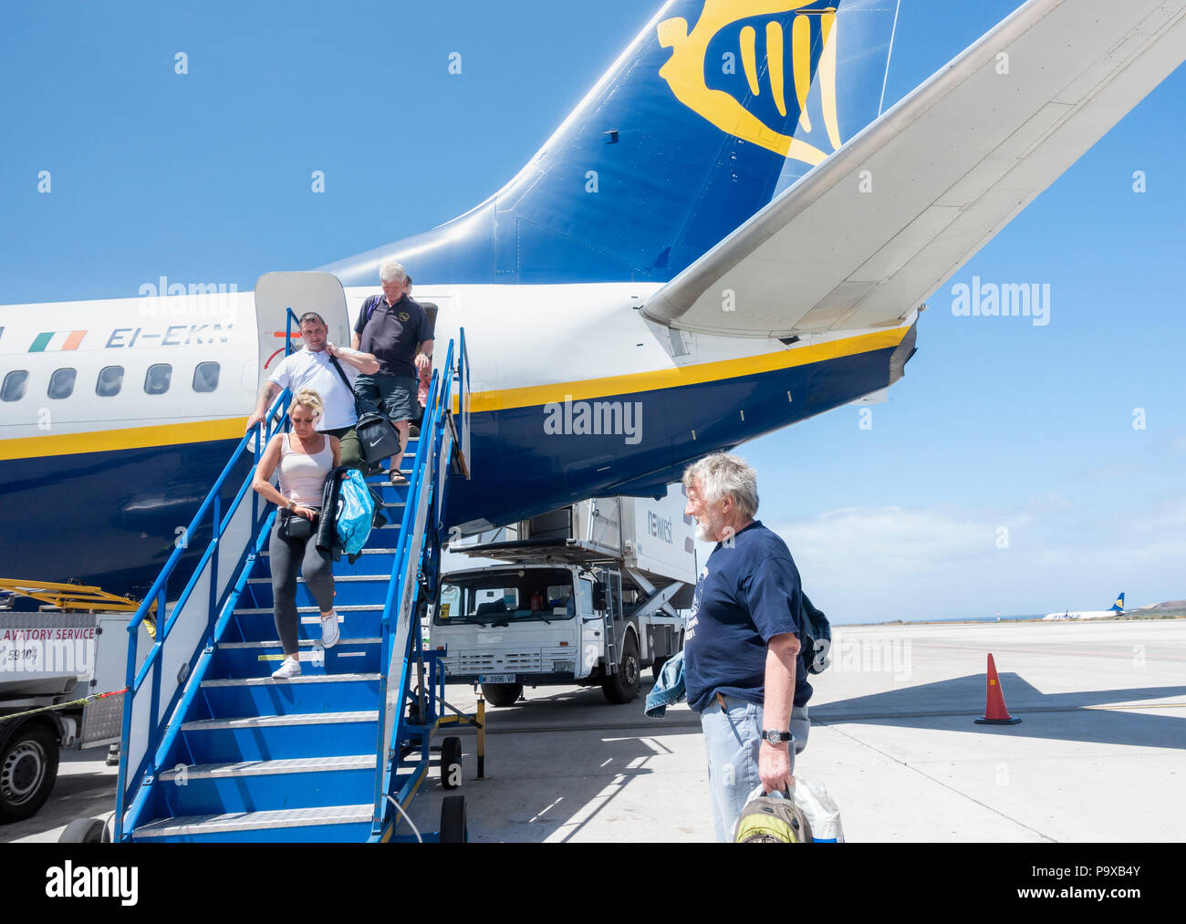 Passengers disembarking from rear door of Ryanair flight Stock Photo