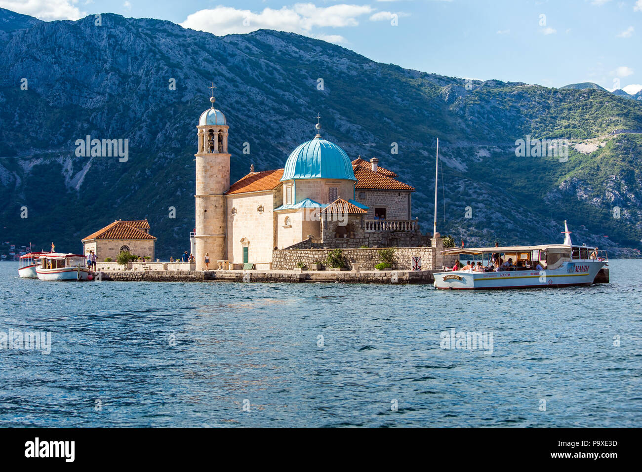 Perast, Montenegro - July, 2018: Small islet near Perast city in Montenegro with he roman catholic Church of Our Lady of the Rocks Stock Photo