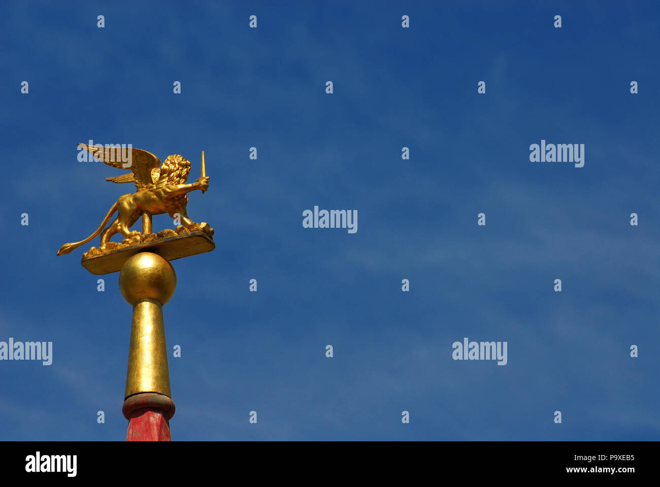 Saint Mark Winged Lion Golden Statuette Wielding A Sword Against Blue Sky A Symbol Of The Old Venice Republic At War With Copy Space Stock Photo Alamy Saint Mark Winged Lion Golden Statuette Wielding A Sword Against Blue Sky A Symbol Of The Old Venice Republic At War With Copy Space Stock Photo Alamy