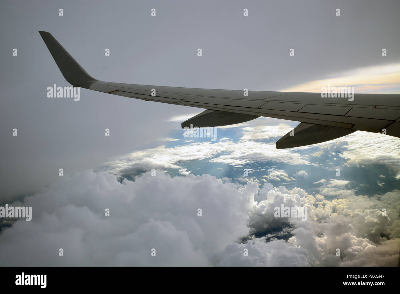 The view from a passenger jet flying high over storm clouds in the ...