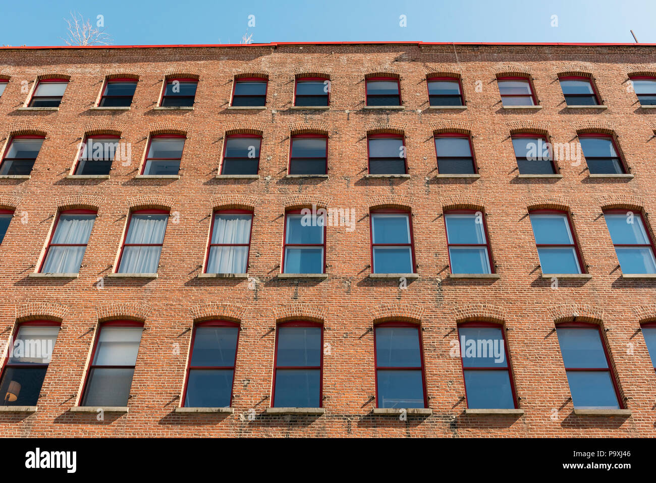 Red-brick facade of The Mill Building in Williamsburg, Brooklyn, New York City, USA Stock Photo