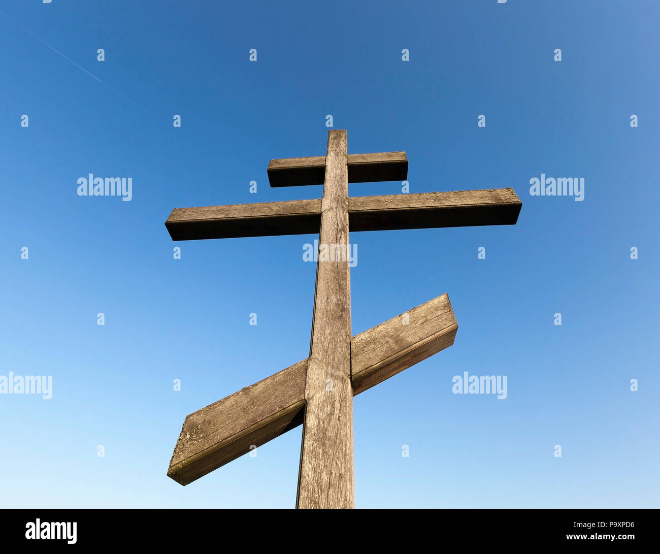 old wooden orthodox cross against the blue sky, closeup photo Stock ...