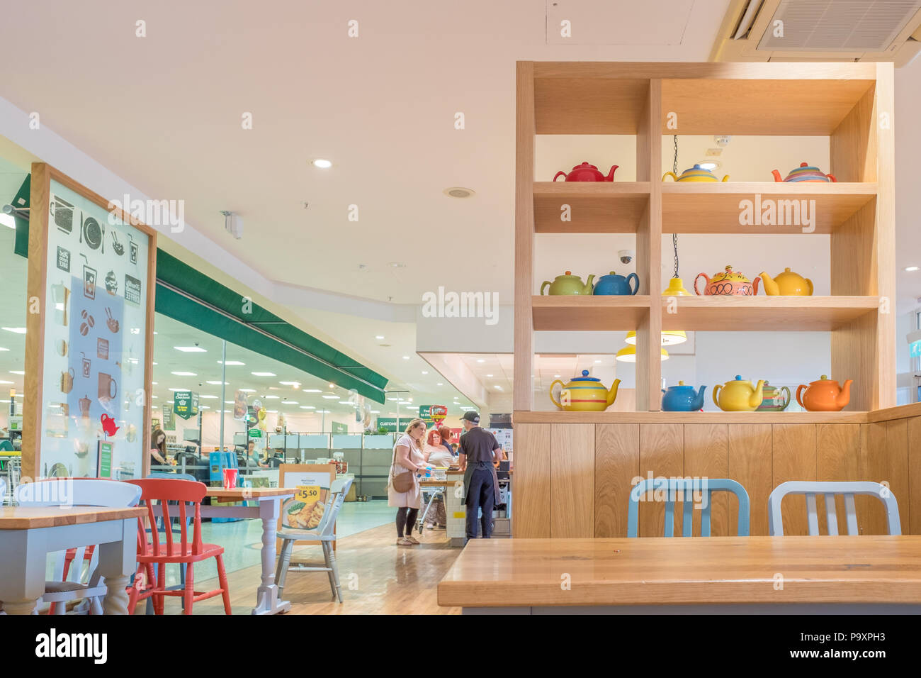 Tables and chairs at the Morrisons cafe in Corby, England Stock Photo