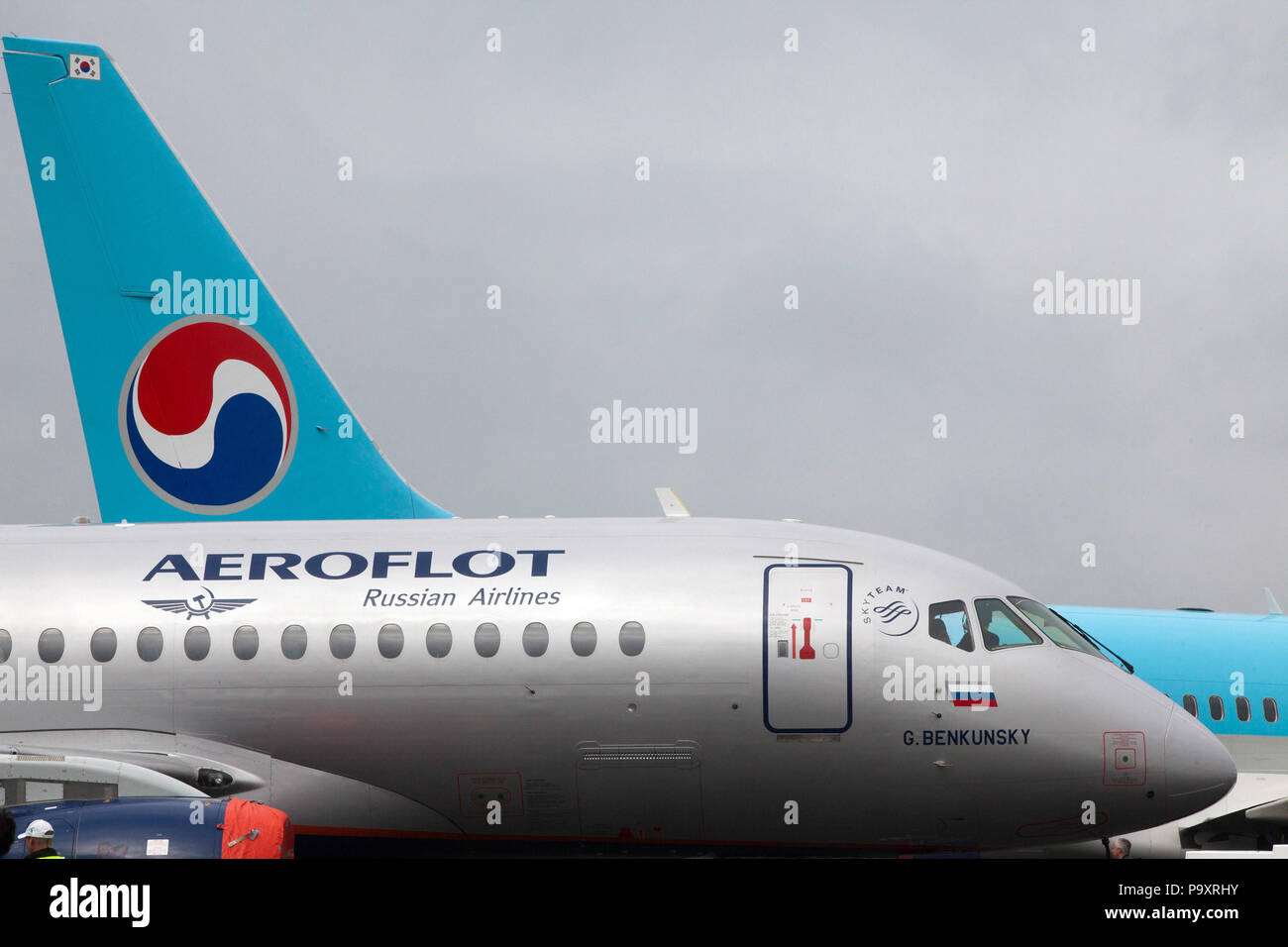 The Sukhoi Superjet-100 airplane of Aeroflot Russian Airlines and Korean Air's Boeing 737-900 displayed at Farnborough-2012 airshow near London, UK Stock Photo