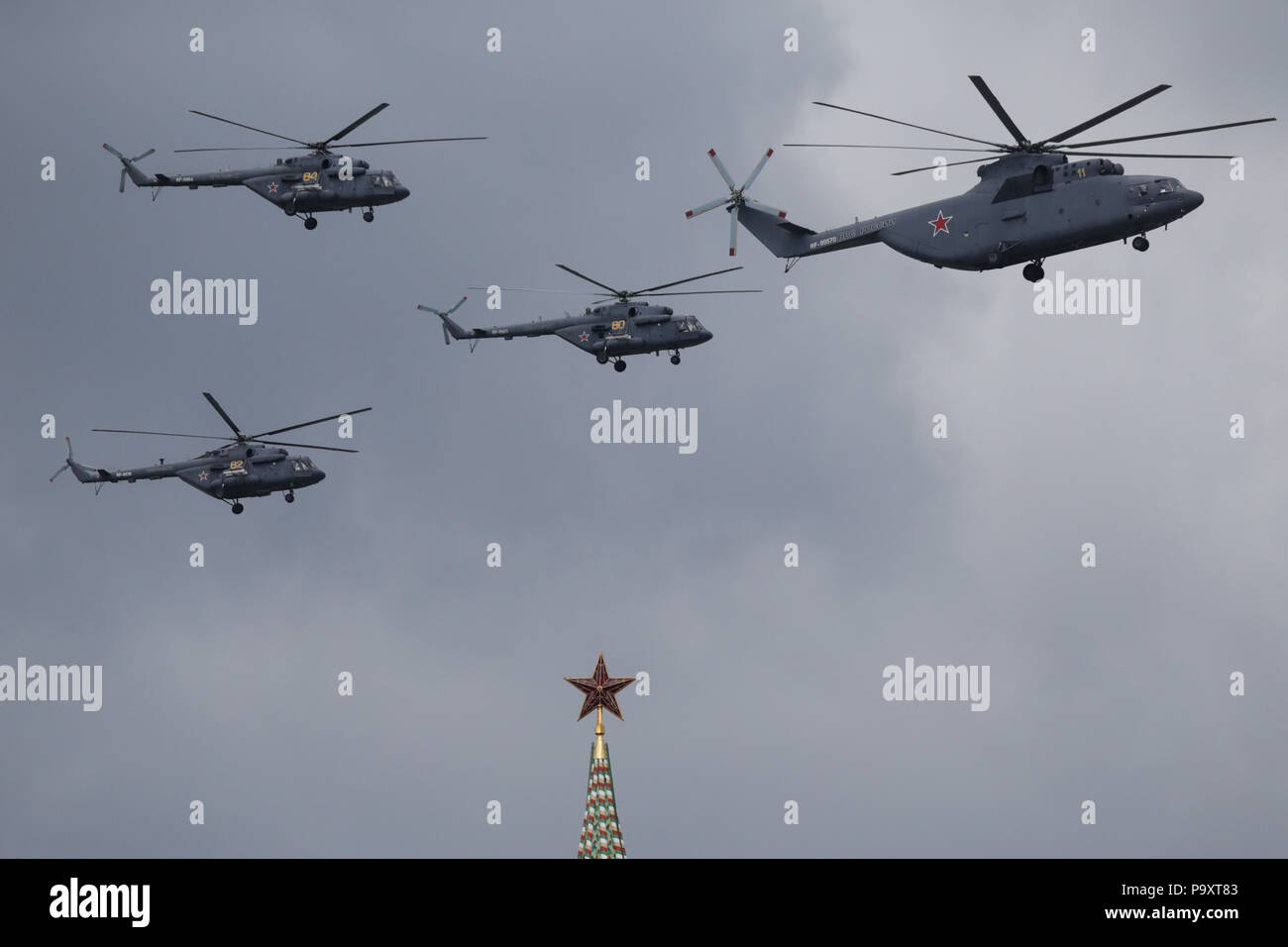 A formation of Mil Mi-26T and Mi-8 helicopters of Russian Air Force fly over the Kremlin of Moscow during a rehearsal for the Victory Day military par Stock Photo