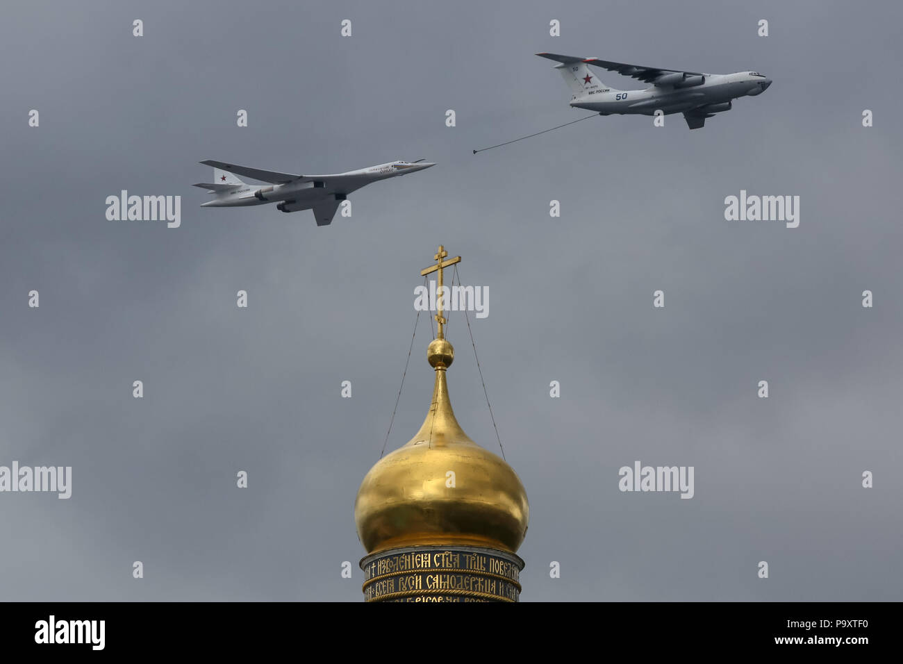 The Ilyushin Il-78 tanker airplane flies in formation with Tupolev Tu-160 strategic bomber   over Ivan the Great Bell Tower of the Kremlin of Moscow d Stock Photo