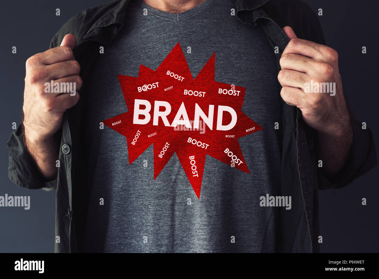 Brand boosting concept with handsome guy showing t-shirt with text mock up Stock Photo