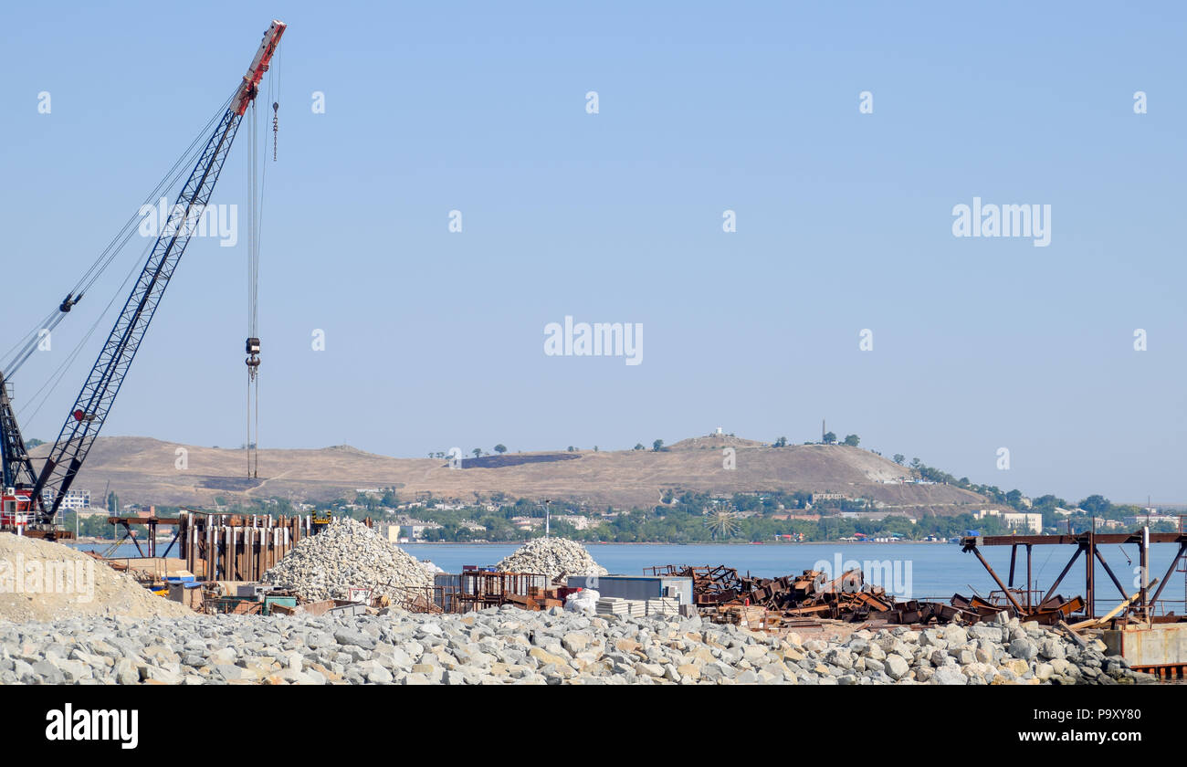 Construction of the Crimean bridge. Piles of rubble and cranes lifted. Construction and repair. Driving along the Crimean bridge. A grandiose building Stock Photo