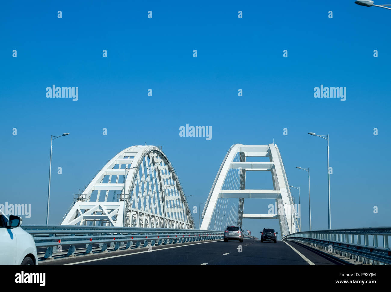 The navigable arch of the Crimean bridge. Arch of the highway and railway section of the Crimean bridge. Stock Photo
