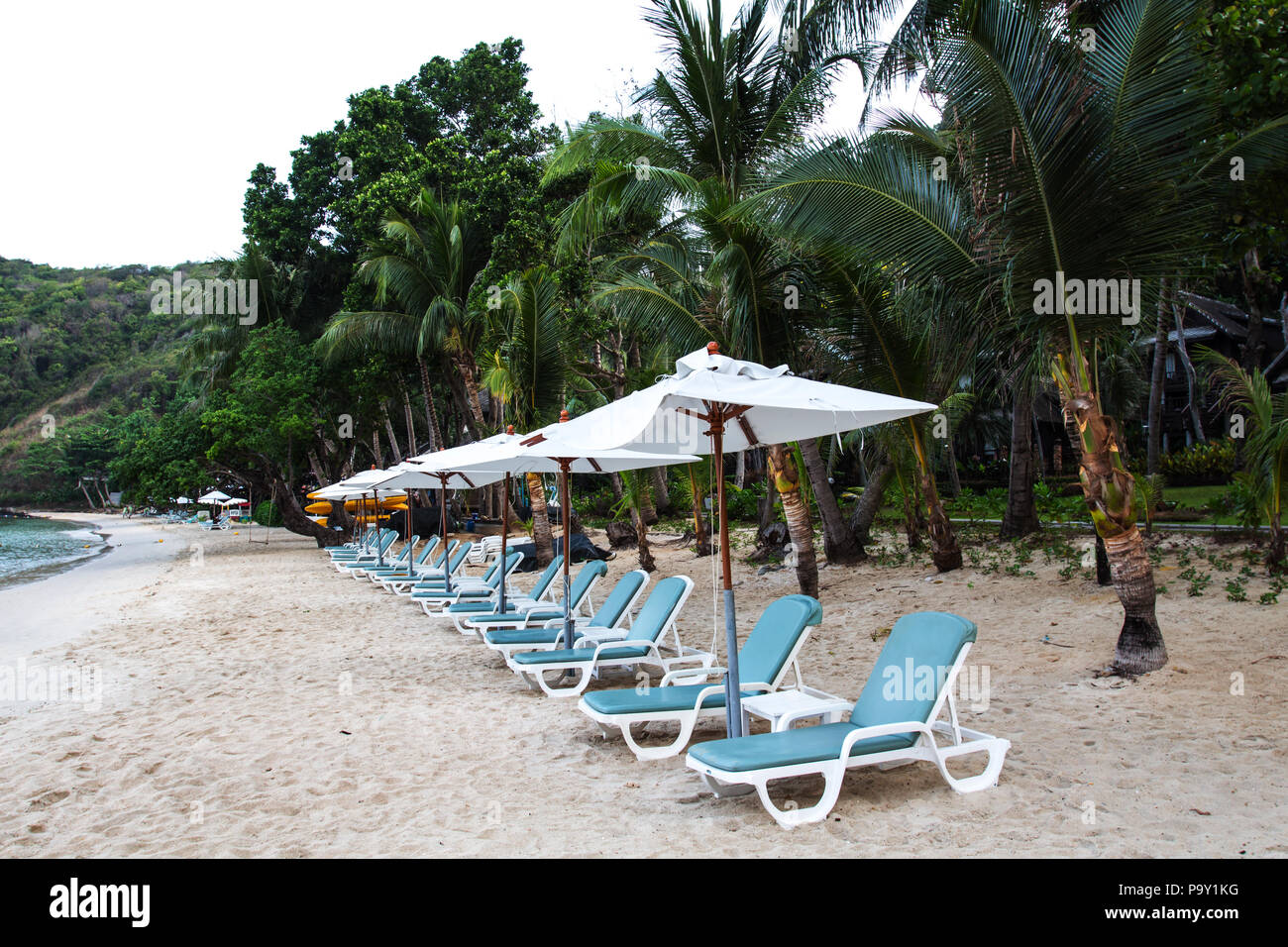 Beach chair with umbrella. Ao Prao, Koh samet. Thailand Stock Photo