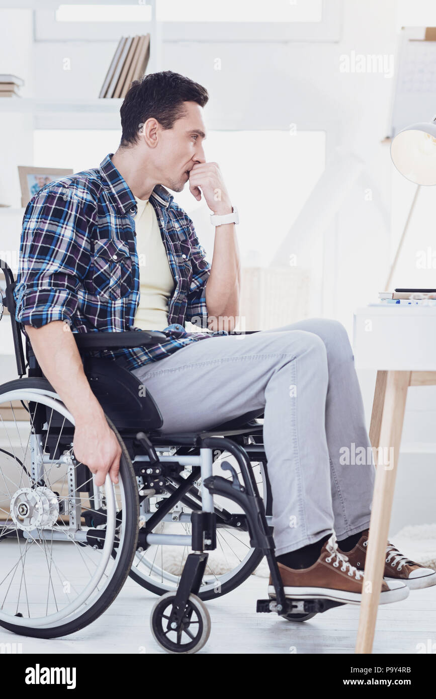Concentrated brunette being deep in thoughts Stock Photo