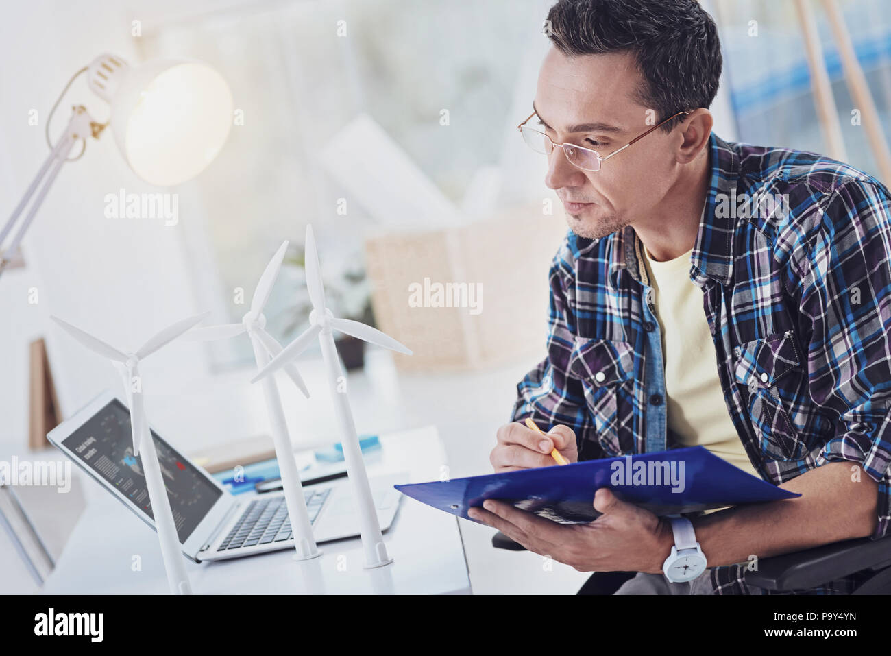 Concentrated brunette man making notes Stock Photo