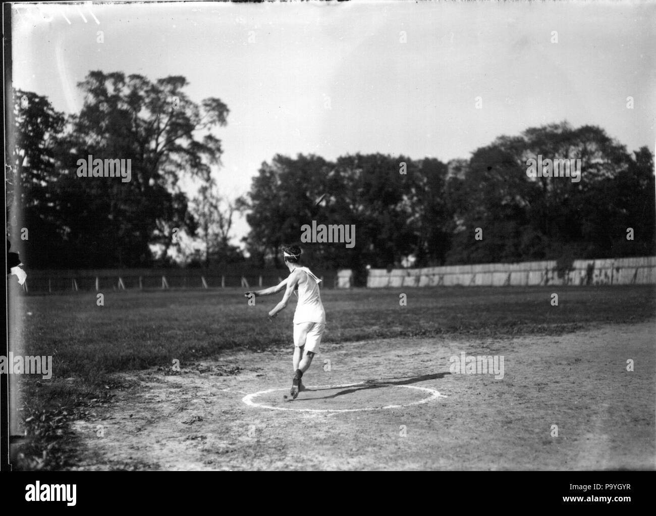 580 Discus throwing event at high school track meet 1912 (3190898193