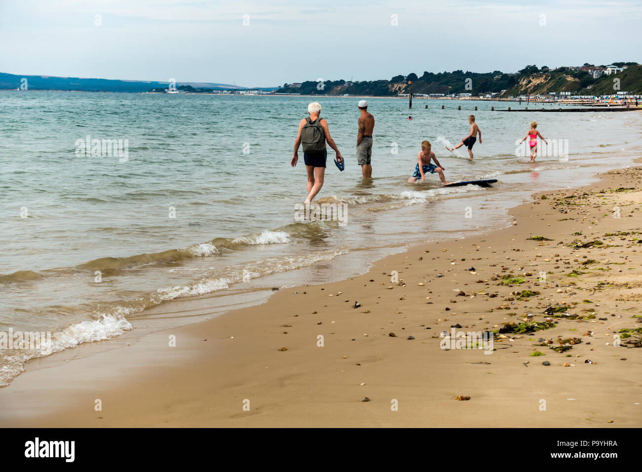 Children playing in the sea on Bournemouth beach in the summer season, UK heatwave, July 2018 Stock Photo