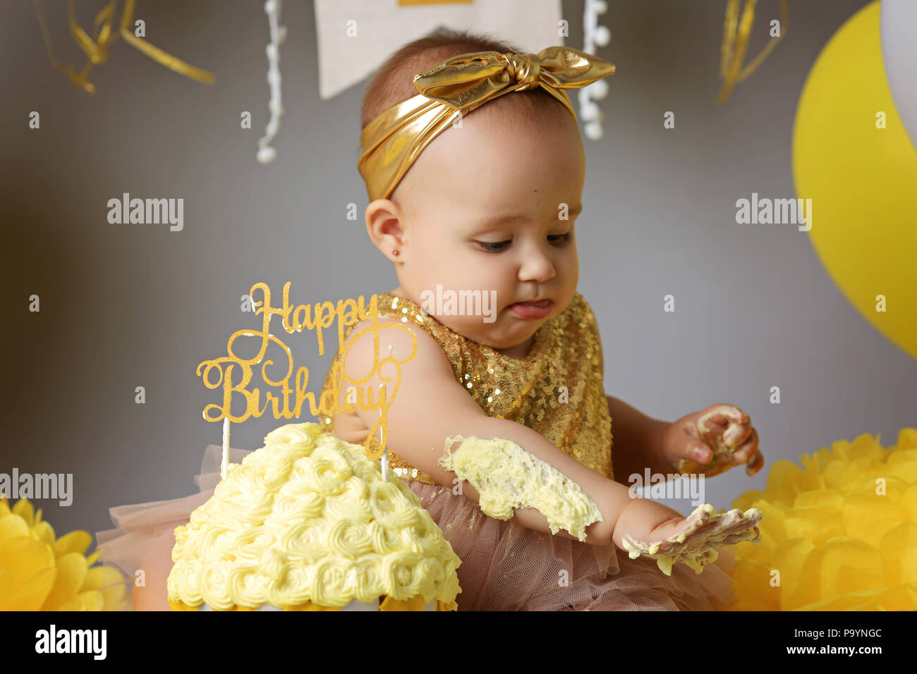 Smiling baby girl celebrating her first birthday Stock Photo