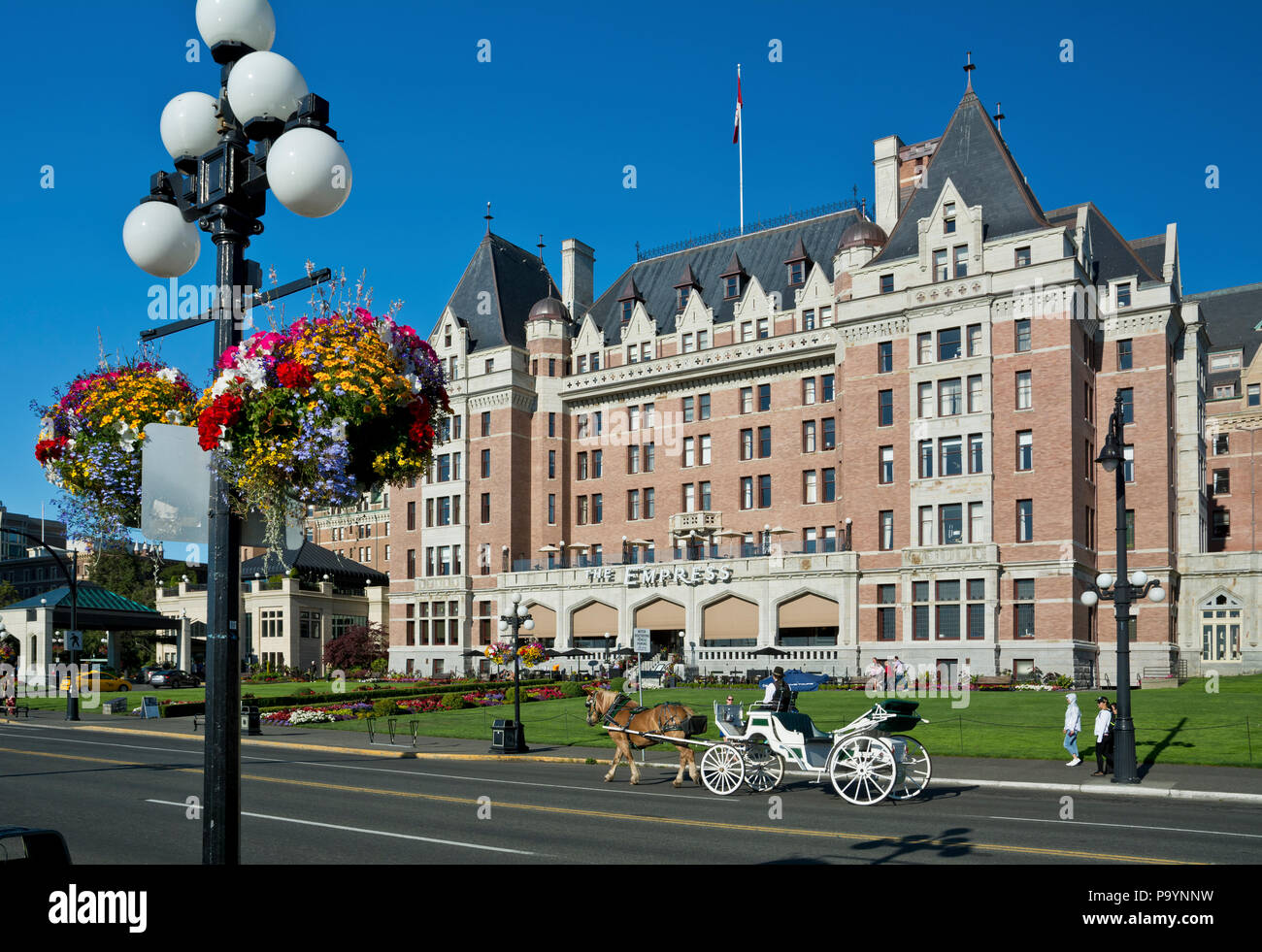 Fairmont Empress Hotel in Victoria, BC, Canada.  Victoria British Columbia Canada Empress Hotel with horse carriage in summer 2018. Stock Photo