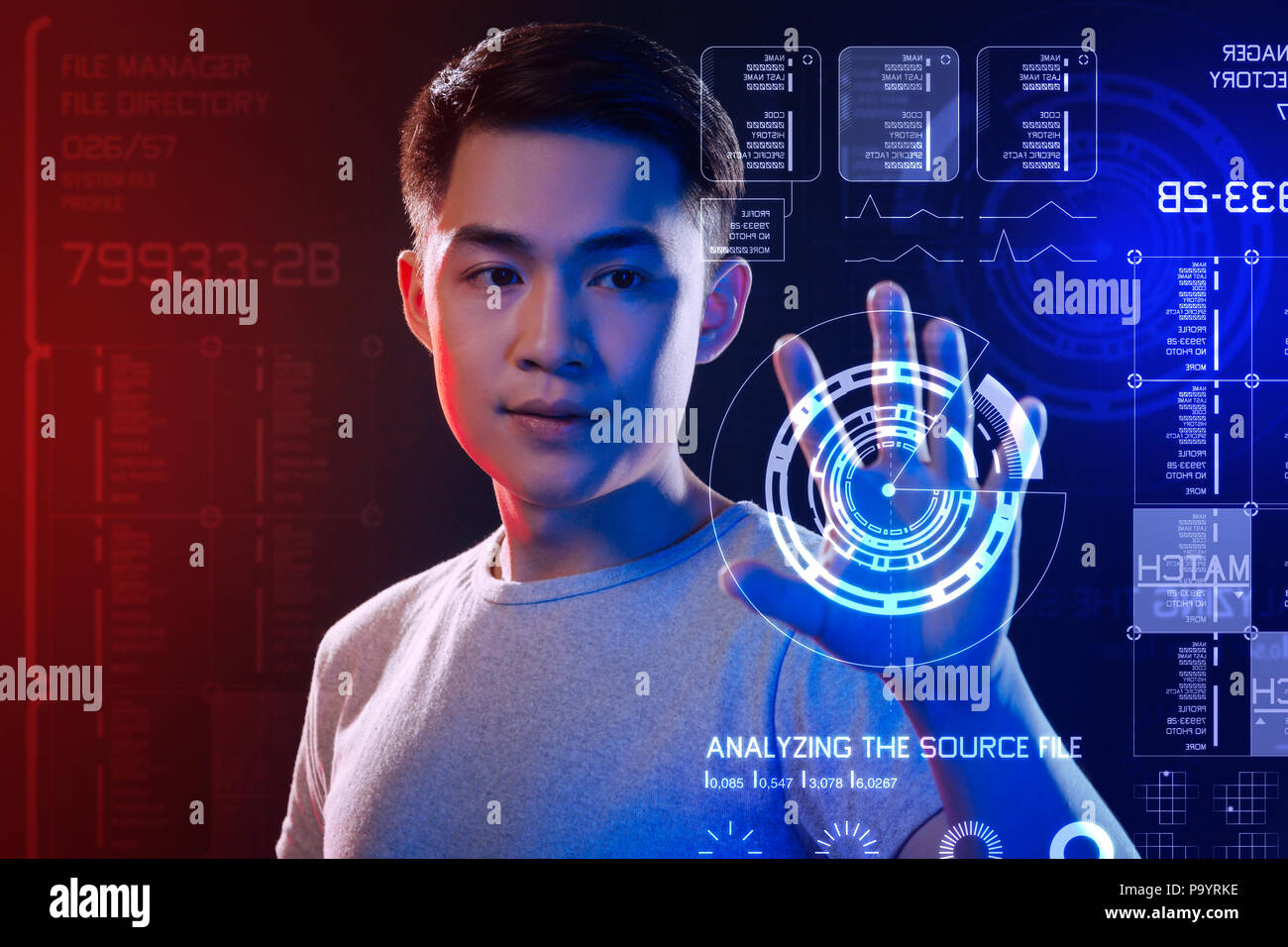 Careful software developer touching the screen while passing a security control Stock Photo