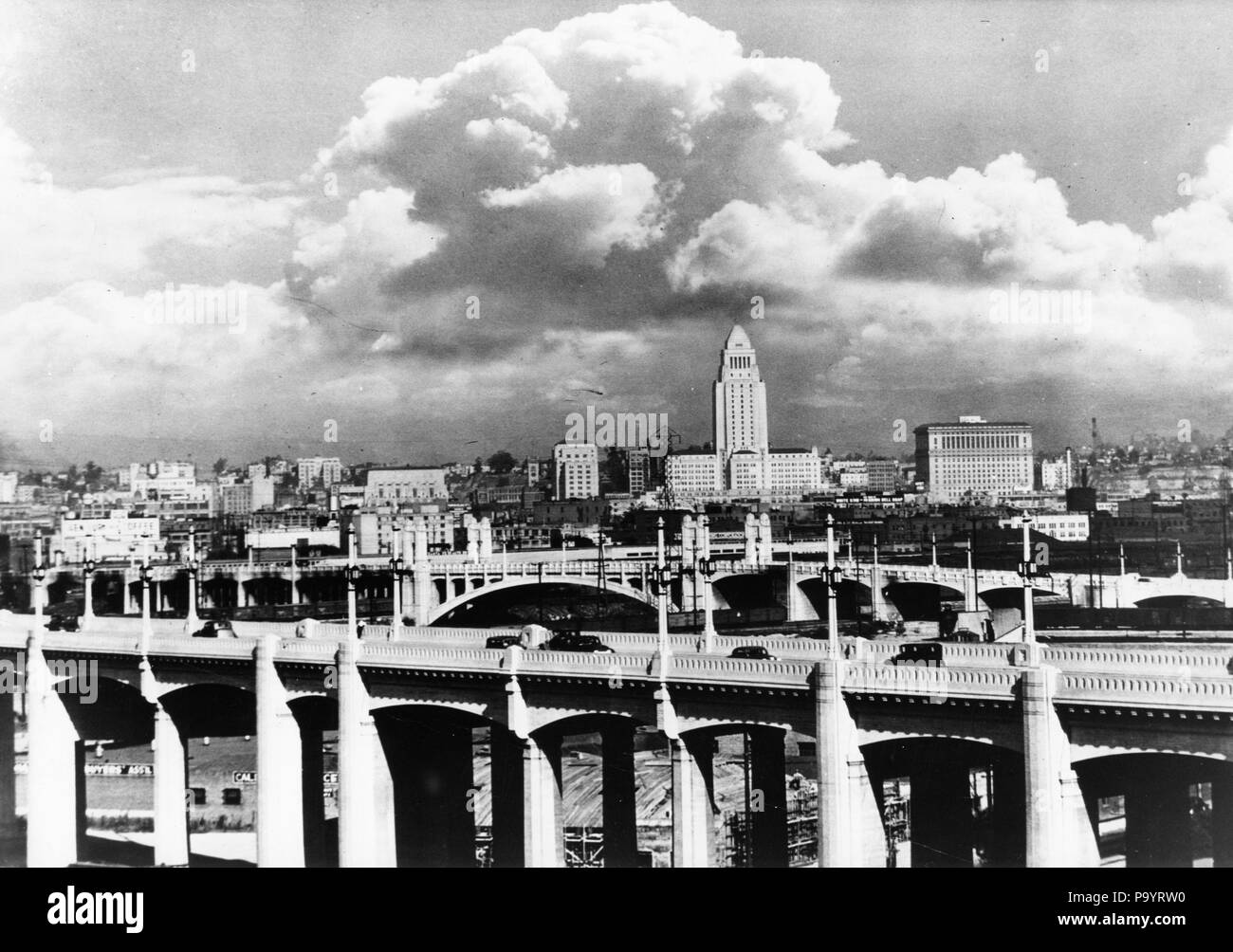 1930s SKYLINE WITH LOS ANGELES BRIDGE IN FOREGROUND LOS ANGELES CALIFORNIA USA - b100 696 ASP001 HARS OLD FASHIONED Stock Photo