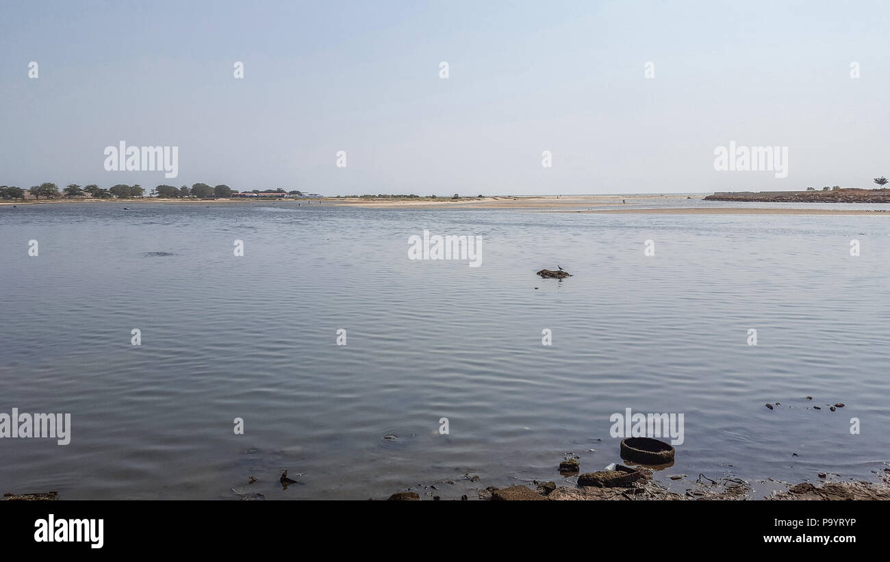 View of the bay of the new marginal in Luanda, with birds, island and ...