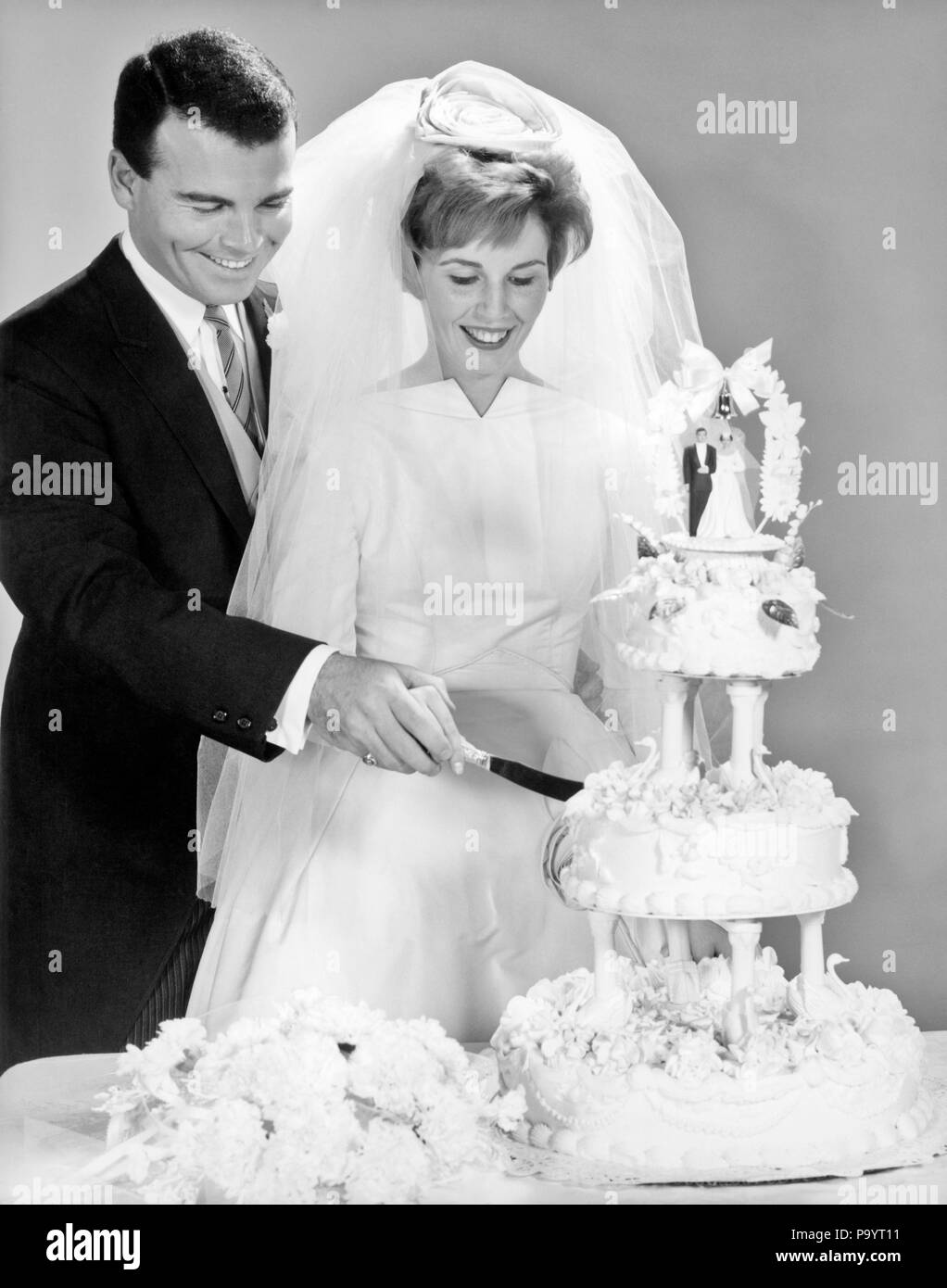 1960s Groom Holding Guiding Bride S Hand While Cutting Wedding Cake B2 Har001 Hars Joy Lifestyle Celebration Females Married Spouse Husbands Half Length Ladies Persons Caring Males B W Dreams Happiness Cheerful Adventure Excitement