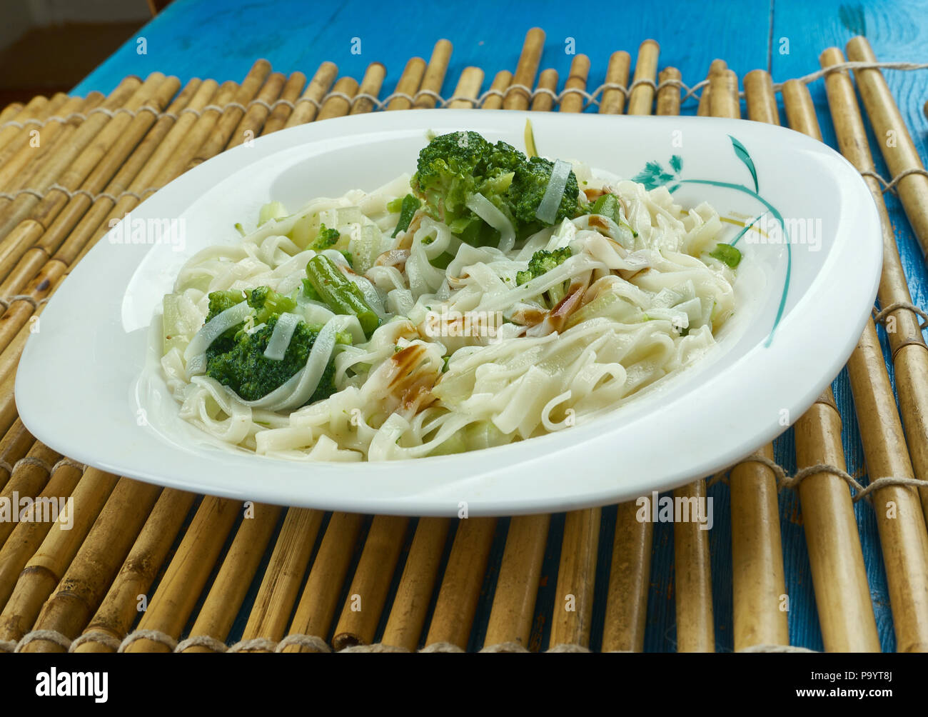Chowmein - traditional Chinese  stir-fried noodles.  popular on Chinese-American restaurant menus. Stock Photo