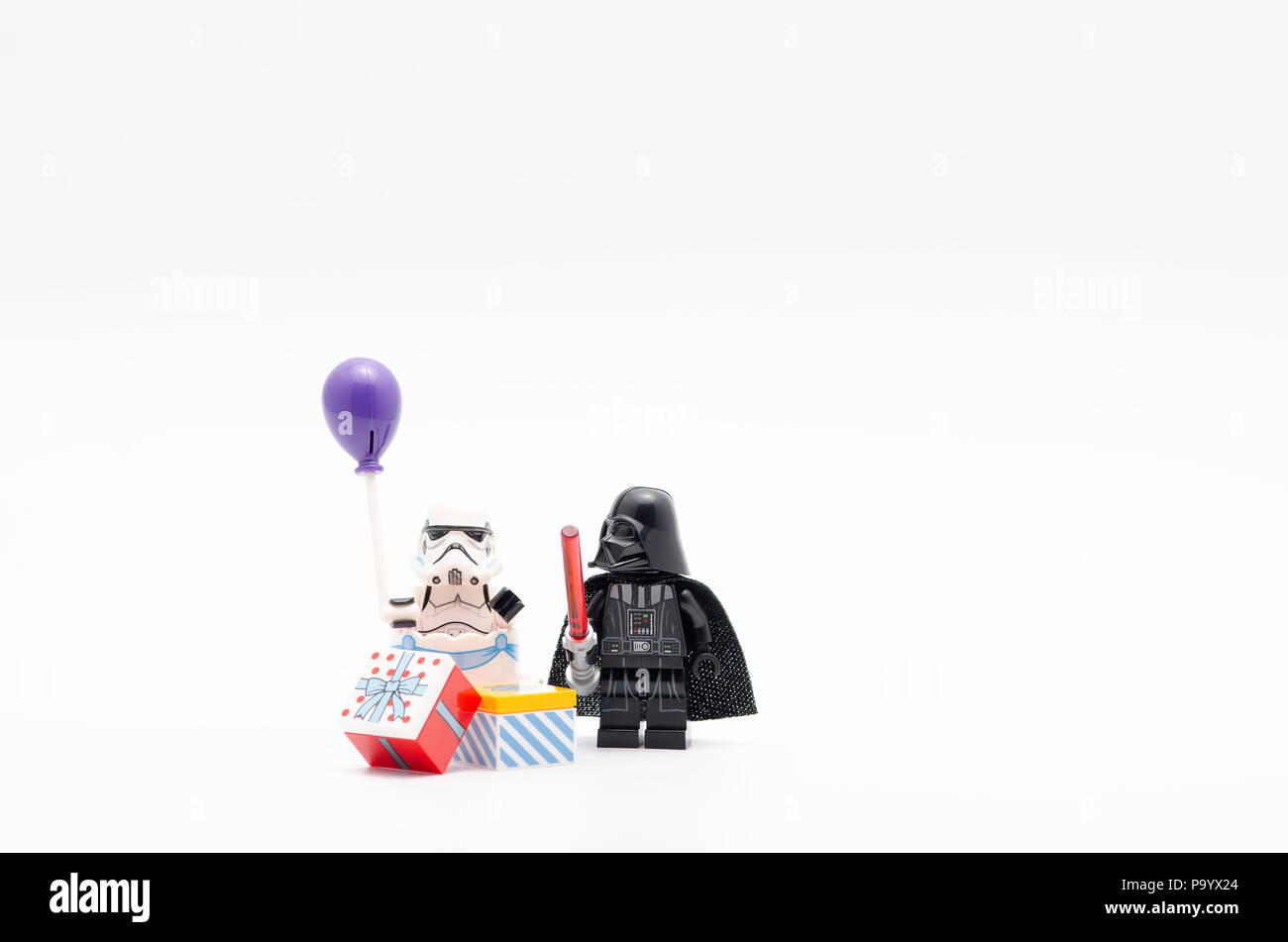 lego darth vader with storm troopers holding a balloon. Lego minifigures  are manufactured by The Lego Group Stock Photo - Alamy