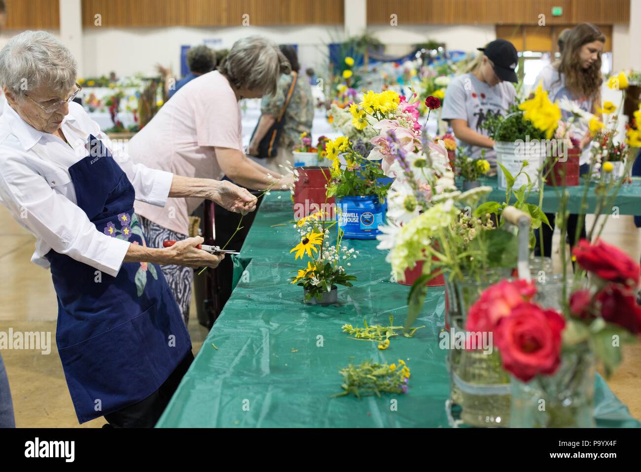 A senior woman working on a flower arrangement, at the Lane County Fair