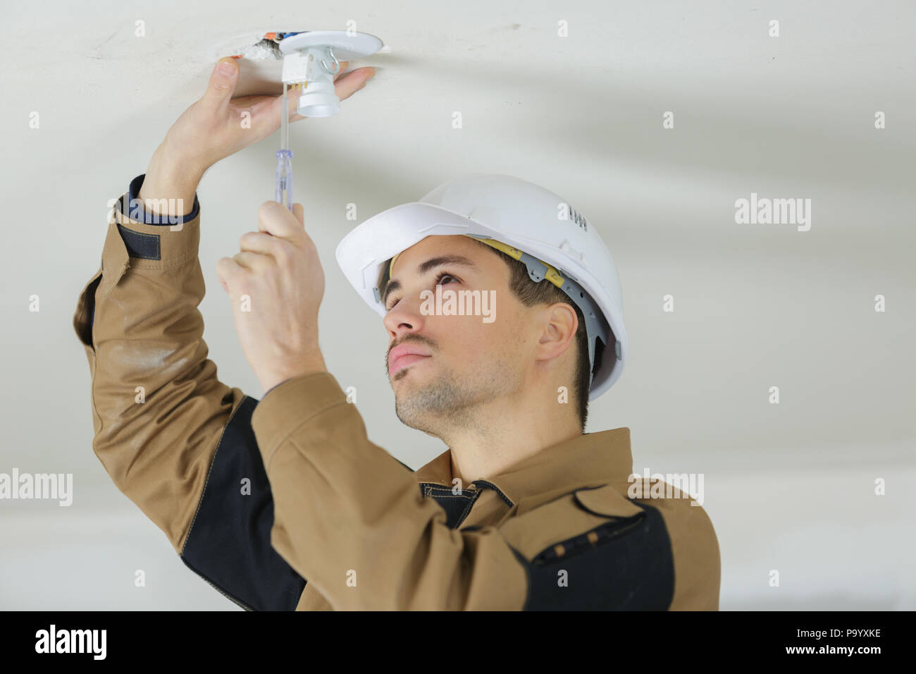 Electrician installing lights hires stock photography and images Alamy