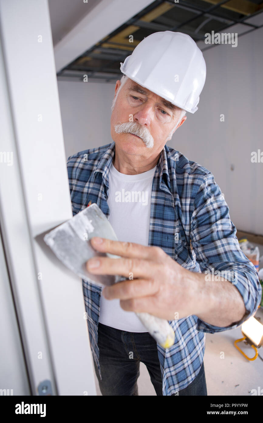 senior professional plasterer Stock Photo