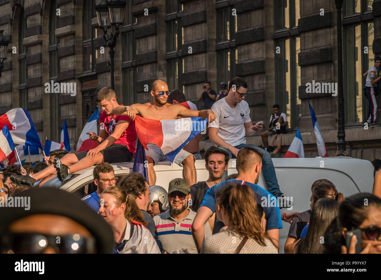 People climbing on cars in France after the 2018 World Cup Final Game Stock Photo